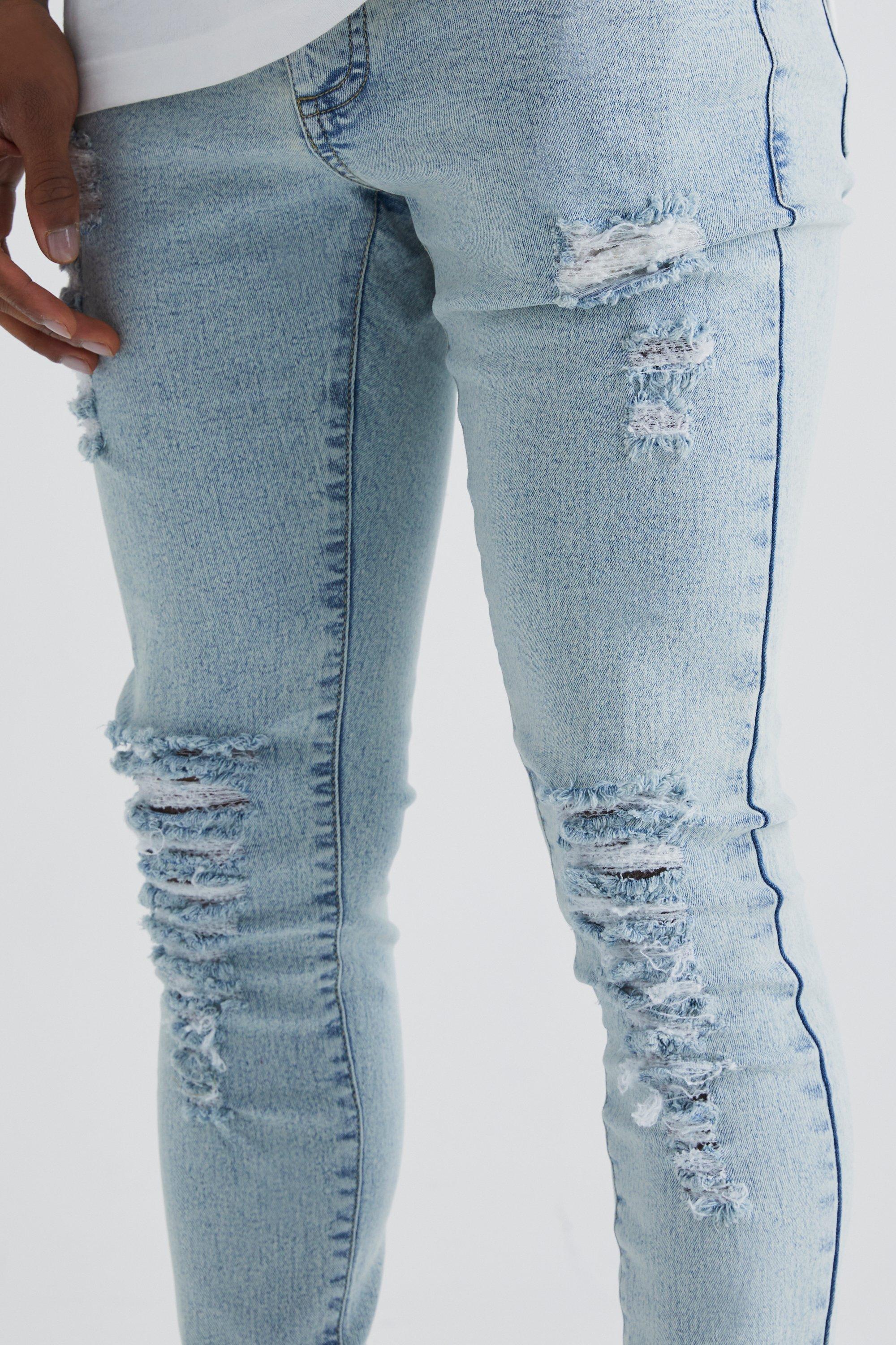 Blue super skinny hot sale ripped jeans mens